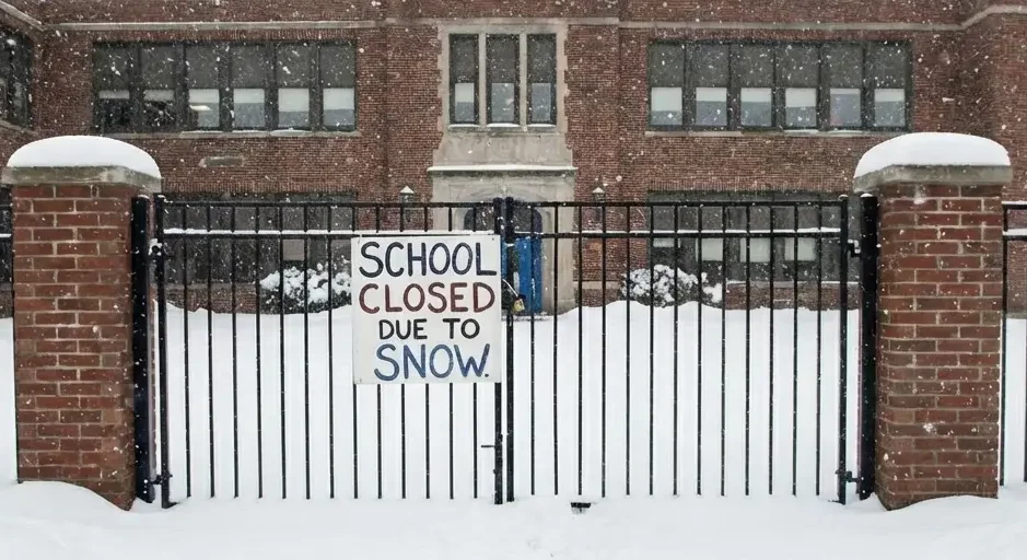 School closed sign in heavy snow